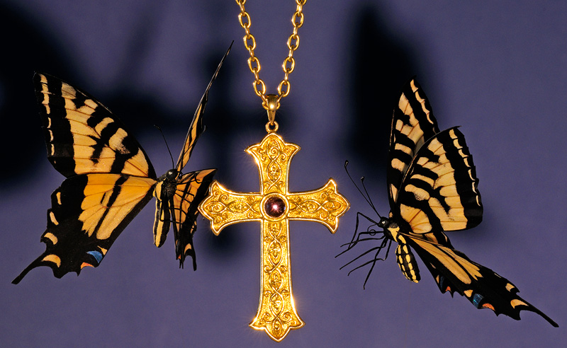 Tiger Swallowtail butterfly replicas with a gold bishops cross