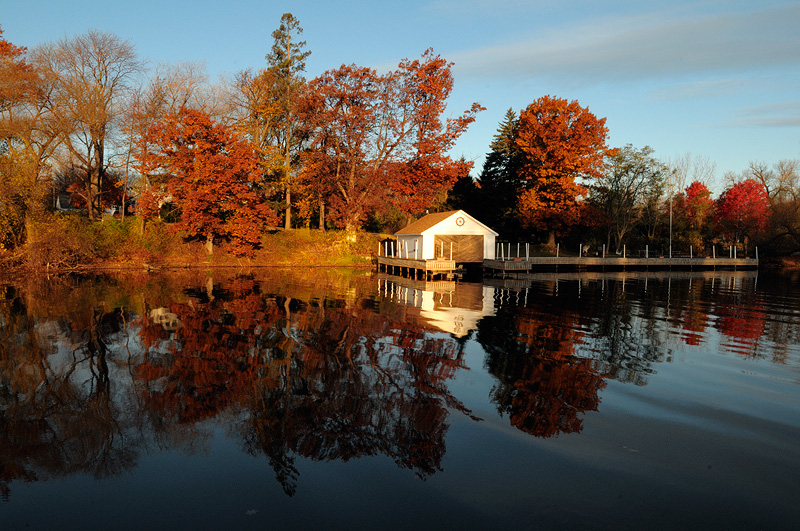 Boat Dock and fall foliage sunrise reflection