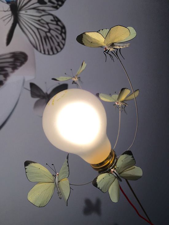 close up detailed view of small white butterflies hand made for Ingo's 5 Butterflies lamp