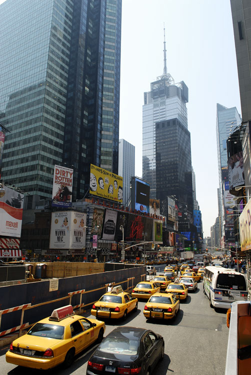 lots of New York ttaxi cabs heading into Times Square