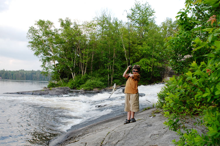 Graham with a largemouth bass on the line