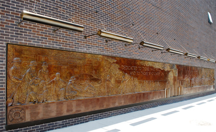  Brass Memorial on the side wall of the Fire House, dedicated to all of the responding emergency personnel